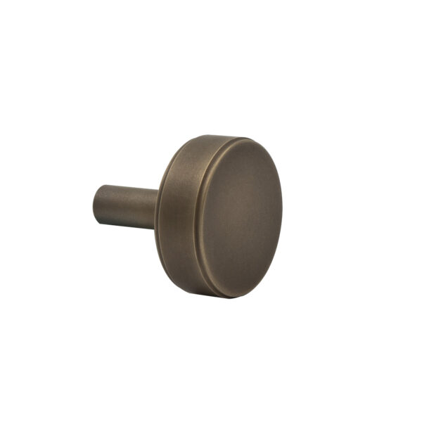 Bronze cabinet knob on a white background.