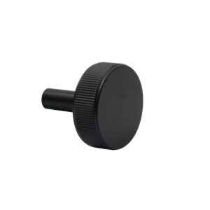 Black round rubber furniture leg cap isolated on white background.